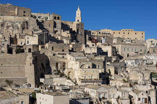 istock panoramic view of ancient sassi di matera buildings under a clear blue sky. historic stone architecture of the unesco world heritage site in basilicata, italy. 2253982028