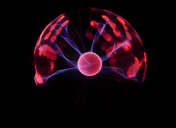Plasma Ball with human hand causing plasma flow to jump to fingers creating unique patterns and textures of light.