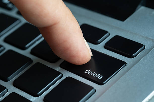 istock Finger of the computer user, he presses the delete button on the computer keyboard. 2253996756