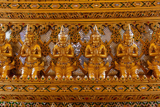 Praying statues part of the Interior design, replica of the Sanphet Prasat Palace, at Muang Boran, in Samut Prakan, Thailand. Known as the Ayutthaya school of design, it was originally the principal royal residence for the king of Siam. It was destroyed in 1767 A.D.