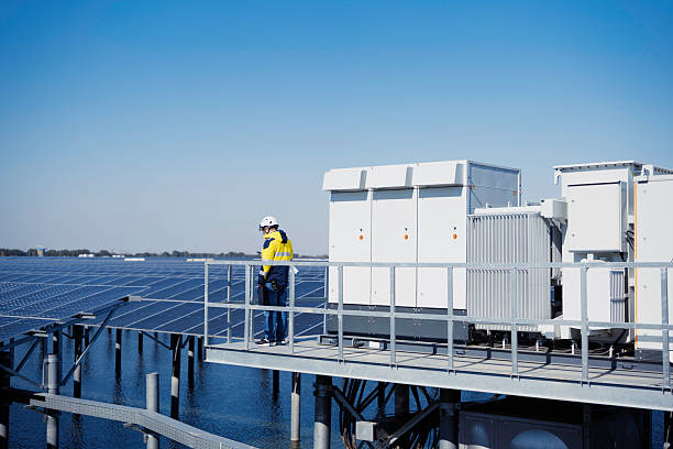 A male worker is inspecting a solar power station.