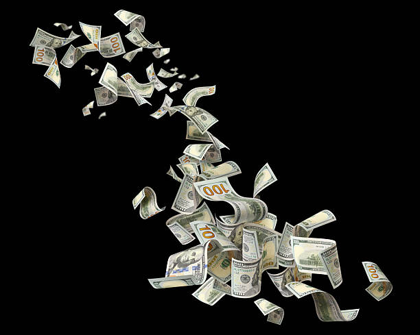 istock Flying hundred dollar banknotes, isolated on black background 2254006078