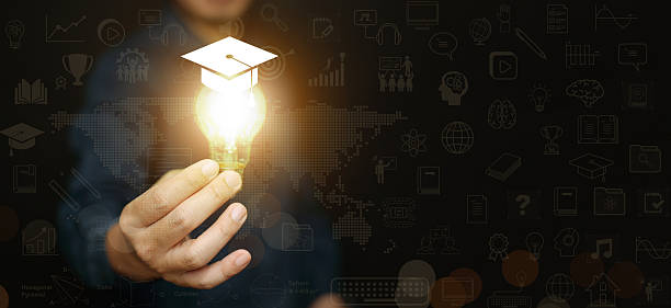 istock A man holding glowing lightbulb with graduation cap against educational icon background. Global education, knowledge, innovation, modern teaching, and the future of digital and online learning. 2254007212