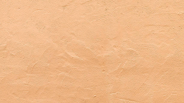 istock Neutral Beige Stucco Wall Texture with Fine Grained Plaster Surface for Minimalist Interior Design Background Architectural Backdrop or Product Mockup Overlay 2254007222