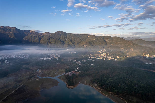 istock Overlooking a lakes,forests, and villages in the mist 2254010149