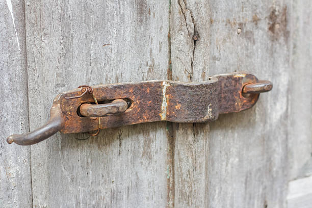 istock an old rusty door latch lock mounted on weathered wood 2254011118