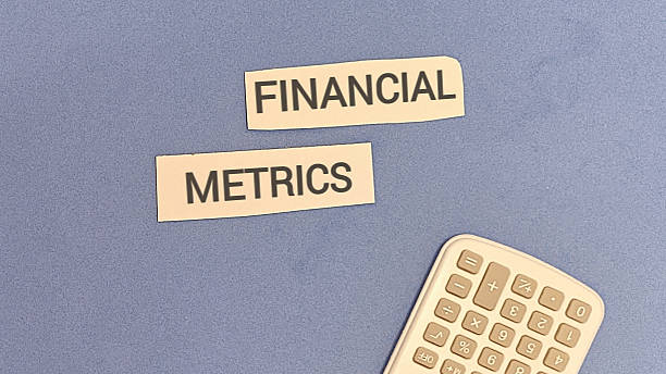 istock Financial metrics concept with calculator on blue background 2254011482