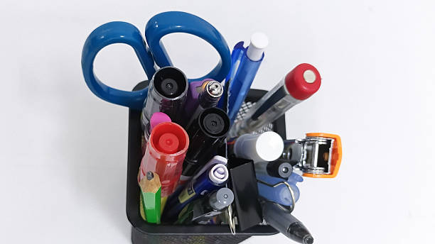 istock Colorful office supplies in a black container on white background 2254011716