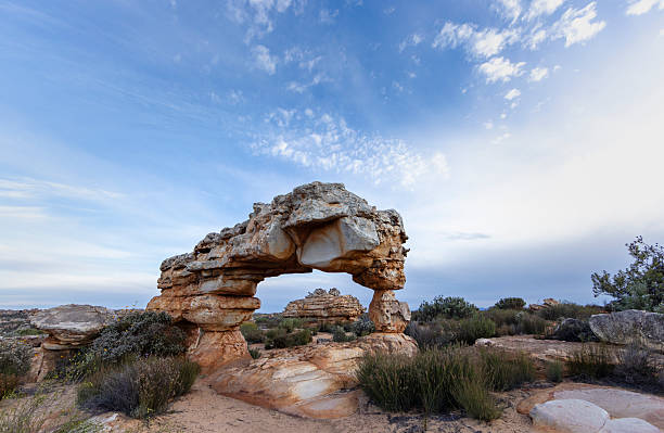 Scenic landscape showing an interesting rock arch and formation in the distance in the Southern Cederberg near Kaggakamma Nature Reserve