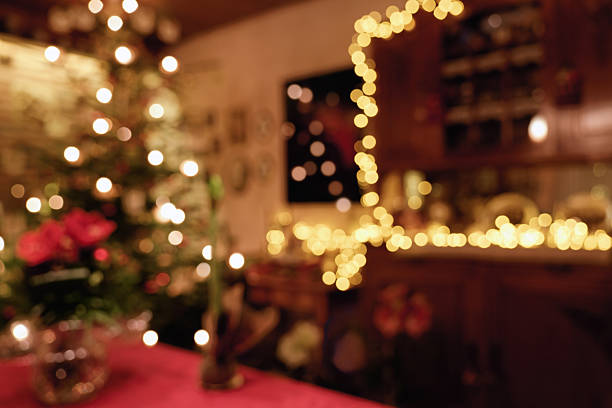 istock Christmas room impression with table decoration, Christmas tree and illuminated sideboard - background 2254012523