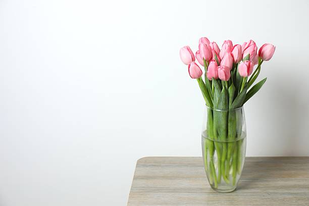 istock Beautiful pink tulips in a vase 2254012949