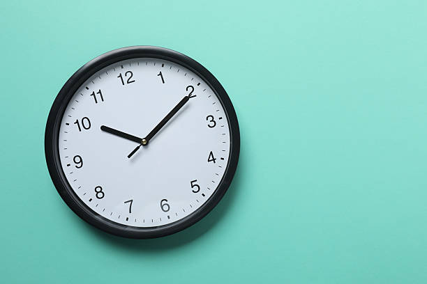 istock Big beautiful stylish clock on color background 2254013056