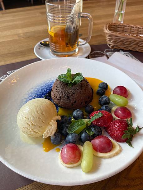 istock Chocolate fondant on a plate with berries, ice cream and mousse 2254014376
