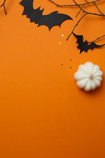 istock Halloween festive background design featuring bats and decorative branches. Halloween concept 2254015075