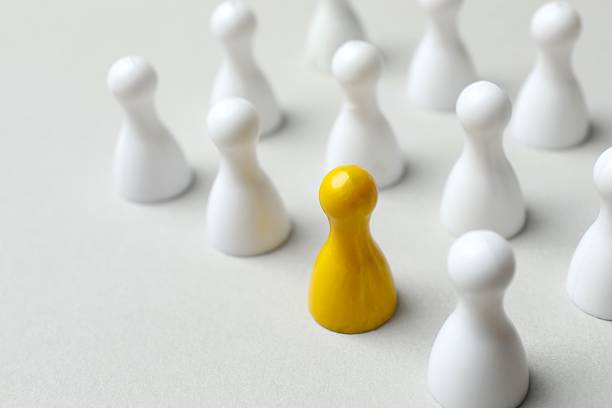 istock Group of pawns on a light background 2254015336