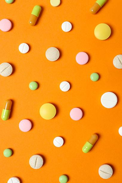 istock Various medical pills on color background 2254018098