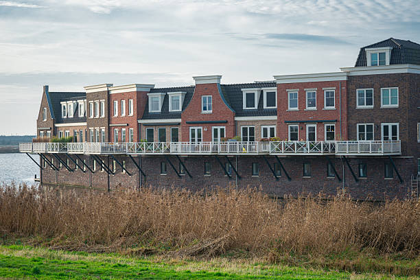 Contemporary Dutch residential architecture along the waterside in new housing district Westergouwe, Gouda, Netherlands.