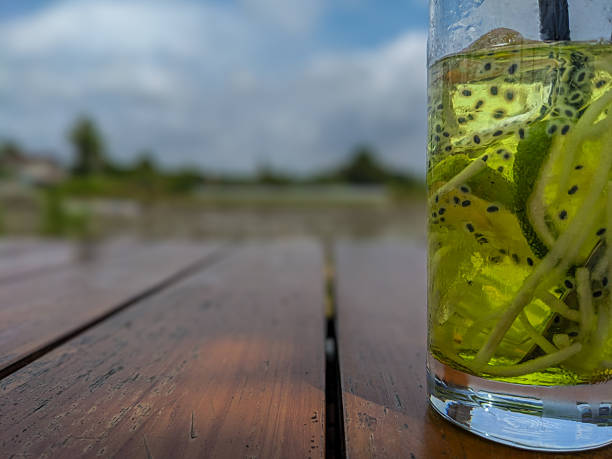 Close-Up Of Sunglasses And Drink On Table