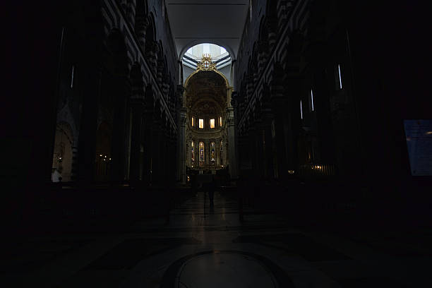 Genova, Italy - 12TH NOVEMBER 2025 - Central nave of San Lorenzo church with altar in the distance and sunlight filtering by windows above