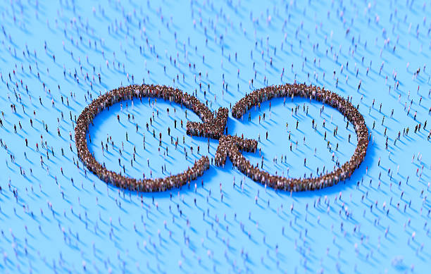istock Human Crowd Forming Arrow Symbols On Blue Background 2254034895
