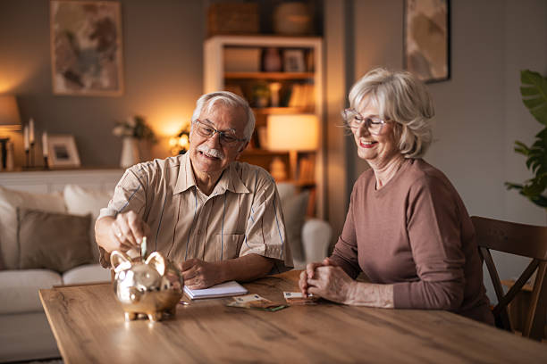istock Warm Family Moment: Elderly Couple Saving Money Together At Home 2254036009