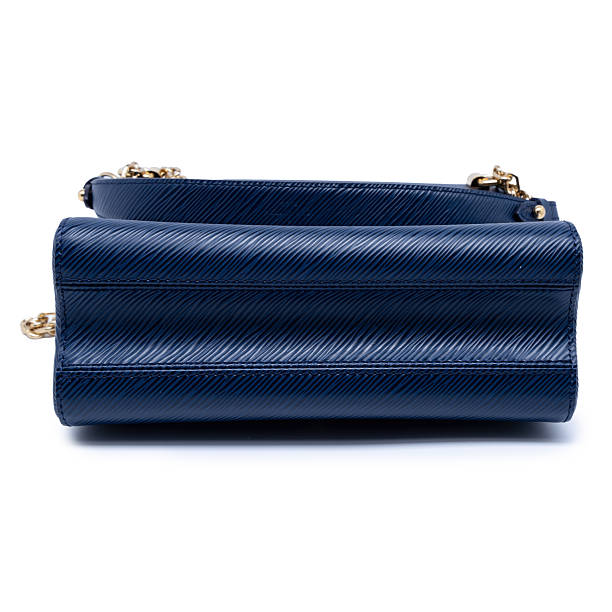 istock Elegant Blue Leather Crossbody Bag With Gold Chain Strap on White Background 2254038314