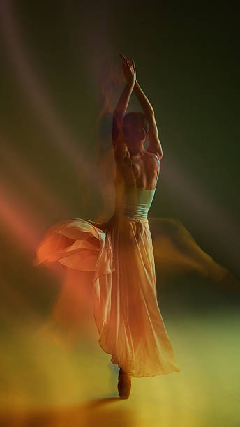 istock Full-body dancer silhouette in warm flowing motion with elegant skirt movement 2254038687