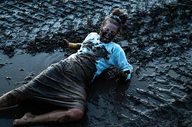 istock A happy authentic woman stuck in a mud puddle in a field 2254038987