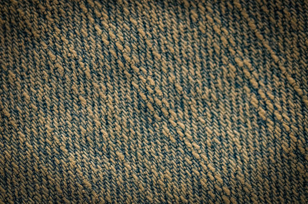 Close-Up Texture of Durable Weathered Denim Textile with Diagonal Pattern