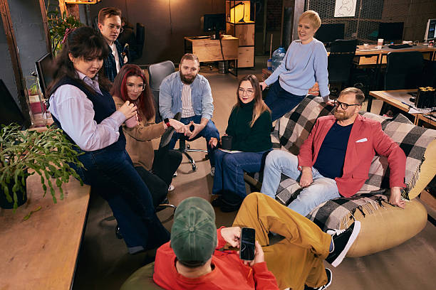 istock Creative team sitting together during casual office meeting. 2254039864