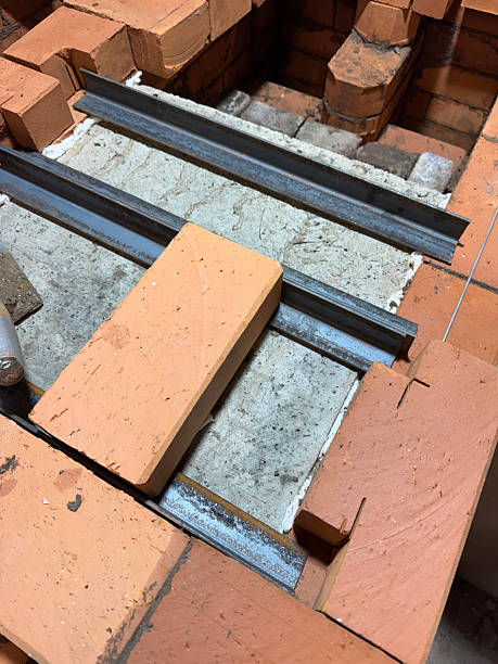 istock Installation of the heating stove ceiling. With concrete slabs and bricks on metal angles. Construction of a heating stove. 2254041027