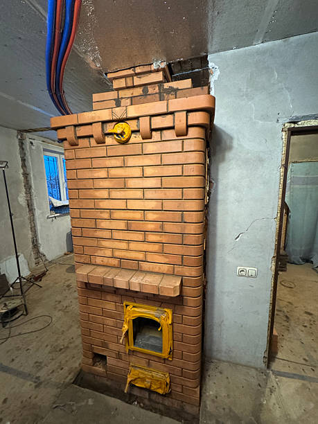 istock Construction of a heating stove. The stove before cleaning and washing. Final work. 2254041048