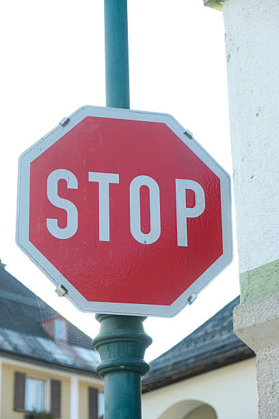 istock Red Octagonal STOP Sign on a Street Post 2254043125