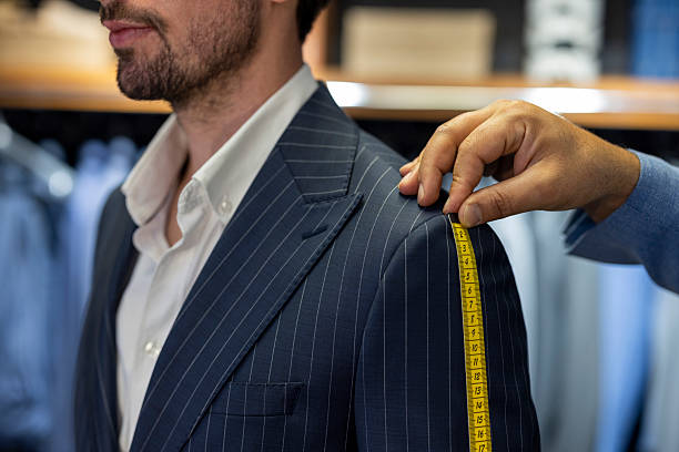 istock Tailor Measuring Shoulder Fit of Custom Made Suit on Male Client 2254044240