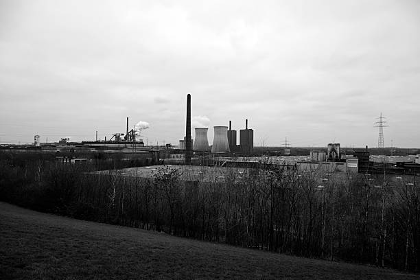 View from a former winding tower of the countryside around Duisburg in the Ruhr area with metalworking industry in the evening light.