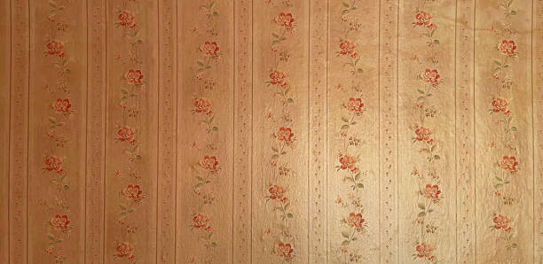 istock Old wallpaper on the wall. Old wallpaper for texture or background. 2254046227
