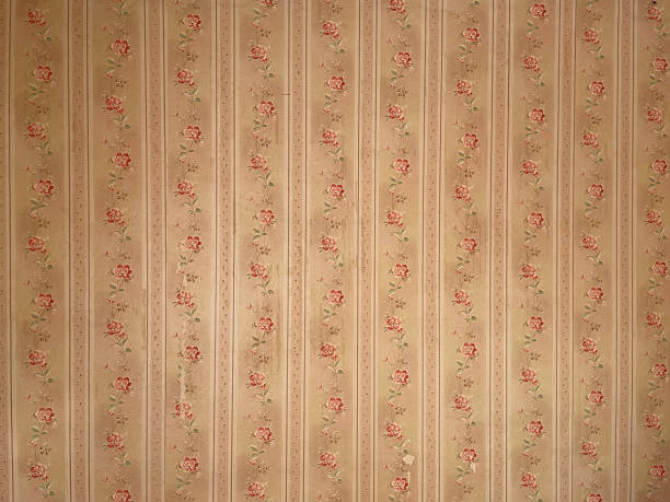 istock Old wallpaper on the wall. Old wallpaper for texture or background. 2254046248