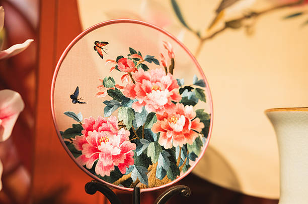 Japanese New Year's images. / Luxurious gold fans with red Japanese paper background. / Chrysanthemum paper cutting