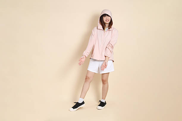 istock 20s Asian woman in pink UV jacket 2254053227