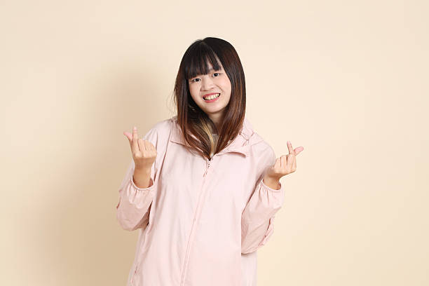 istock 20s Asian woman in pink UV jacket 2254053287
