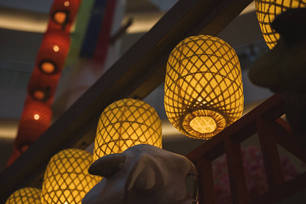 Frome, Somerset, England, UK - December, 6 2014: Seasonal concept photo showing magically illuminated Chinese-style Rhinoceros at night. The oriental scene was recreated using a wooden frame work covered in coloured canvas and lit by low voltage light bulbs; as part of a display in a Chinese Festival of Lights.
