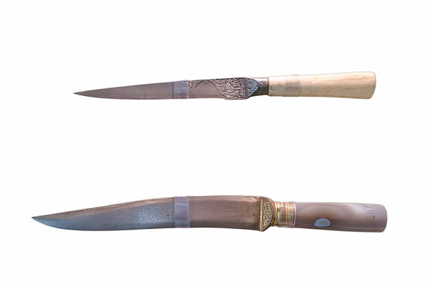 Two well crafted knives are displayed, highlighting intricate designs and varied handle materials. Each demonstrates unique artistry, ideal for collectors and culinary enthusiasts.