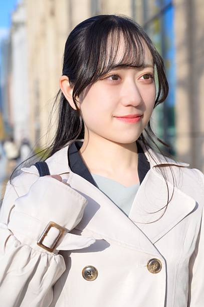 A Japanese woman walking in the office district on her way to work