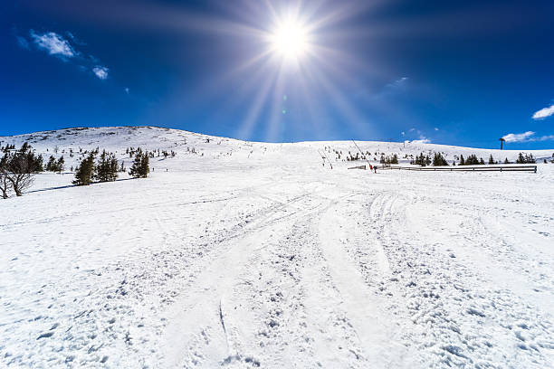 istock High Altitude Winter Sun Over Snowy Mountain Slope 2254067746