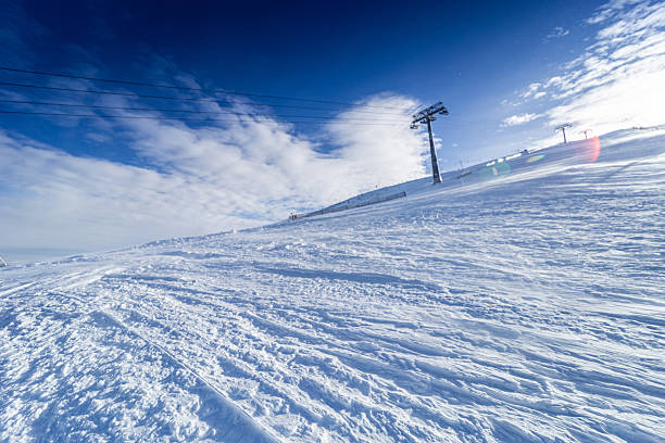 Ski slope. High mountain  landscape  At the top. Italian Alps  ski area. Sunny Ski resort Passo tonale. italy, Europe. Clear blue sky.