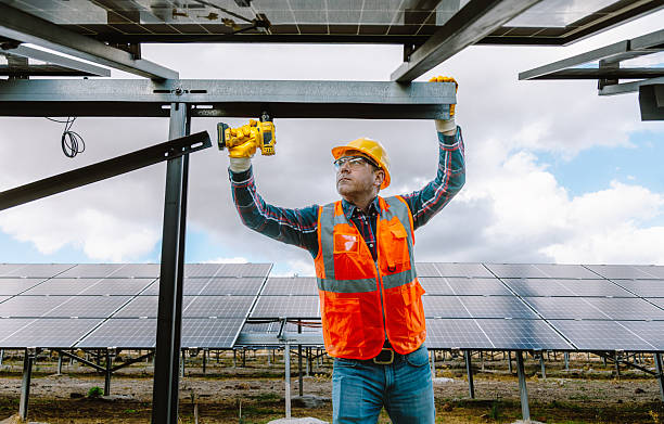istock Experienced Construction Worker: Elderly Man Building Metal Fence with Drill 2254068399