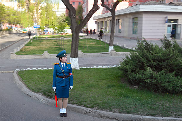 Pyongyang, North Korea - May 1, 2019: Traffic girl regulates traffic at an city street. One of the symbols of Pyongyang