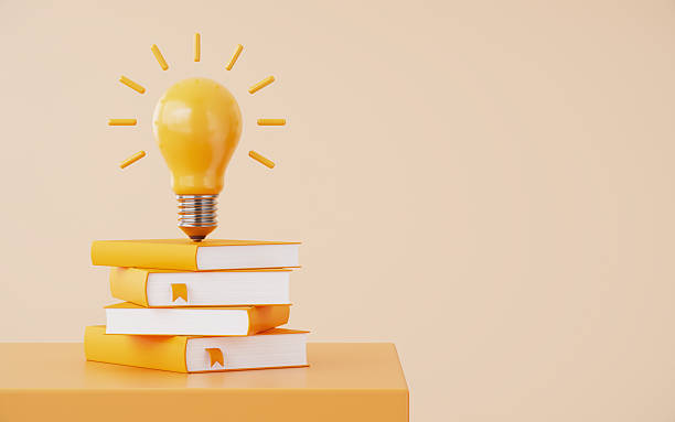 istock Yellow Light Bulb on Same Color Books Over Beige Background 2254071347