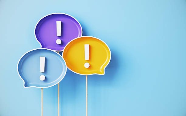 istock Exclamation Point on Colorful Speech Bubbles Over Blue Background 2254071459