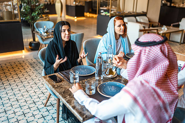 istock Lively Discussion Among Arab Guests in Fine Dining Venue 2254073035